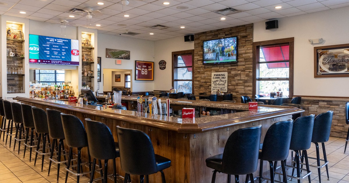 Interior, a bar with bar stools waiting for the guests