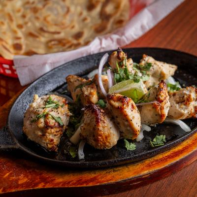 Barbecued boneless chicken, with herbs and spices.