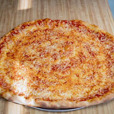 Cheese pizza served on a wooden board.
