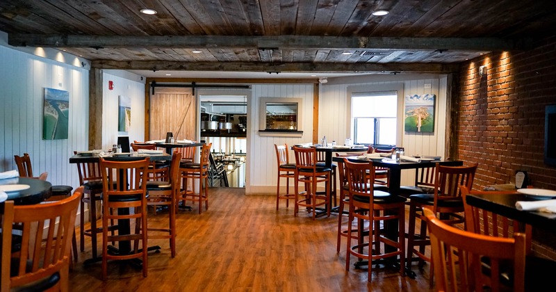 Interior, wooden high tables and chairs