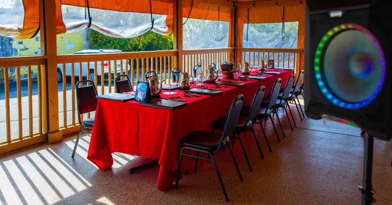 Exterior, covered patio, table ready for guests