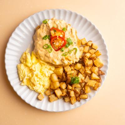 Country fried steak topped with chorizo gravy with side of home fries.