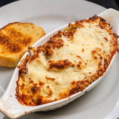 Lasagna served with garlic toast.