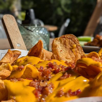Chips loaded with melted cheese and bacon.