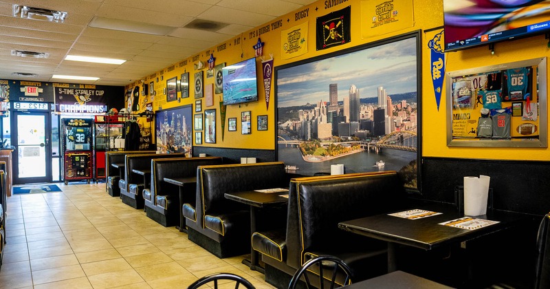 Interior, restaurant booths near wall with pictures