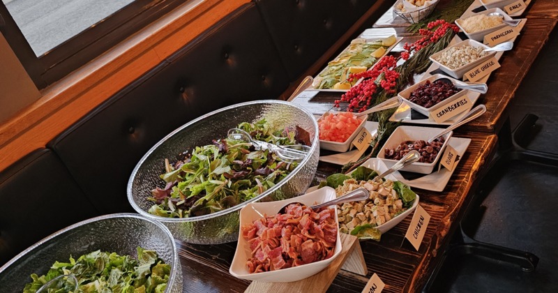 Buffet spread featuring a variety of labeled items