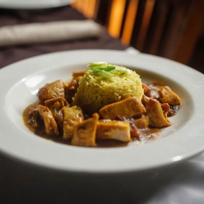 Irish Curry served with rice, garnished with scallions.
