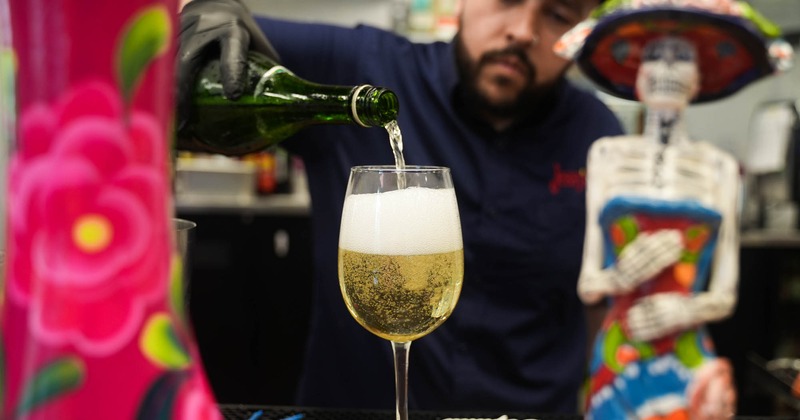 Bartender pouring Champagne