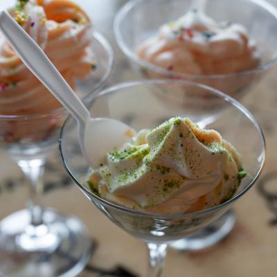 Ice cream served in martini glass with a spoon.