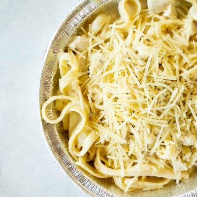 Pasta dish topped with grated cheese.