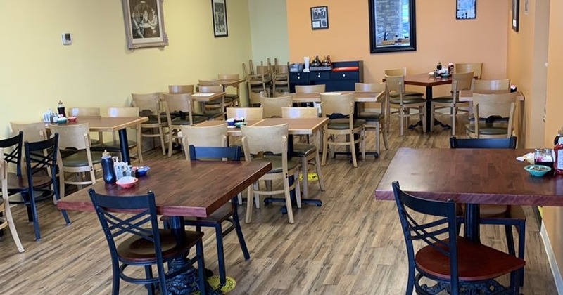 Dining area with wooden tables and chairs
