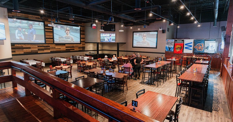 Interior, seating area, high and regular seating tables, large format projector canvases