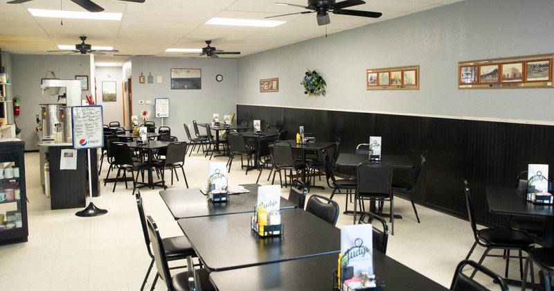 Interior, black tables and chairs in dining area
