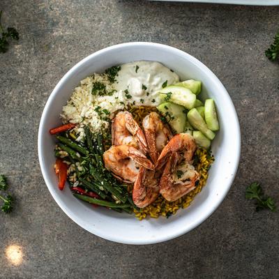 Rice bowl with shrimp and veggies.