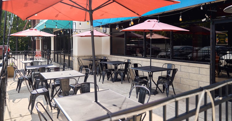 Exterior, tables with parasols and chairs