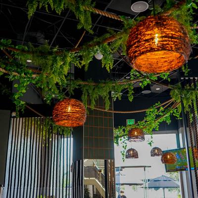 Hanging floral decorations and handwoven lanterns.