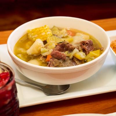 Beef soup with corn potatoes and vegetables.