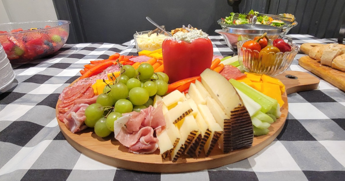 Charcuterie board with cheese, grapes and meats