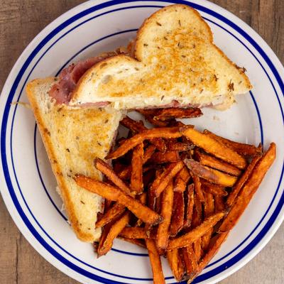 Grilled sandwich with sweet potato fries.