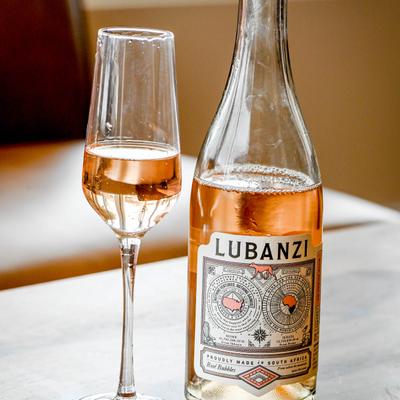 A bottle and glass of Rose.