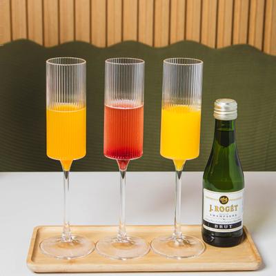 Mimosa flight on a wooden serving tray.