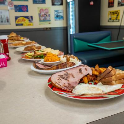 Breakfast plates displayed along diner counter.