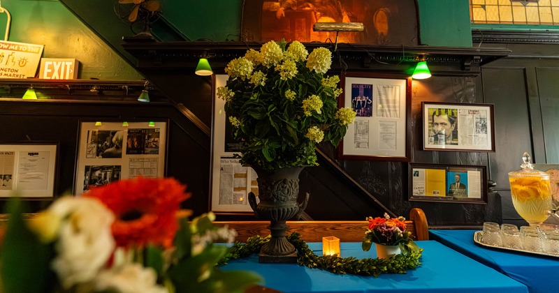 Interior, green leather booths, dark wood