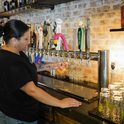 Bartender pouring a beer from the tap.
