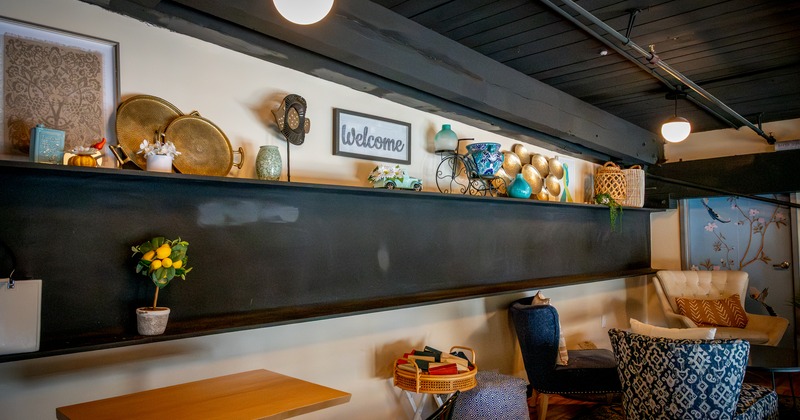 Interior, tables and chairs by the wall