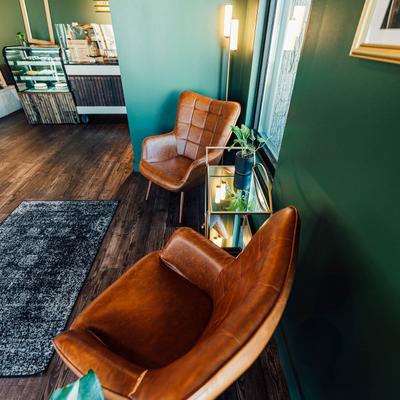 Interior, upholstered arm chairs.