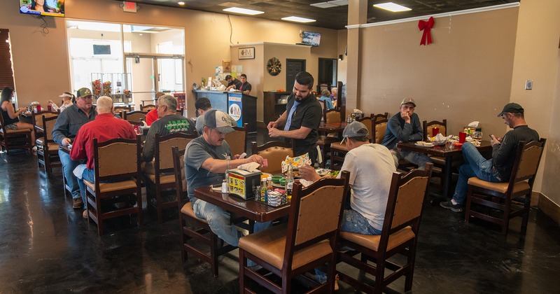 Interior, dining area, guests chatting and enjoying their food and drinks