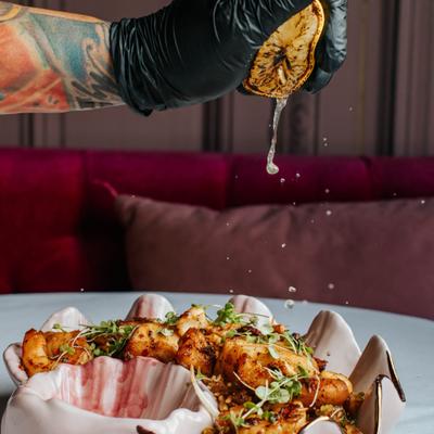 Spicy seafood fried rice with grilled lemon.