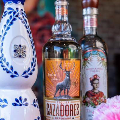 Three tequila bottles, close view.