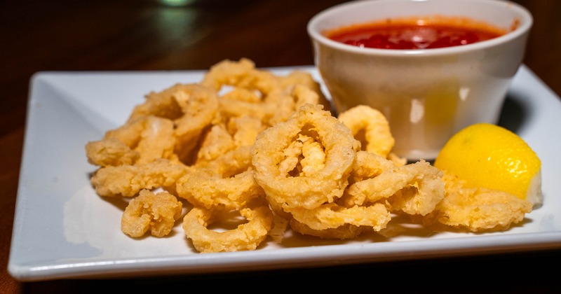 Fried calamari with a dip on the side