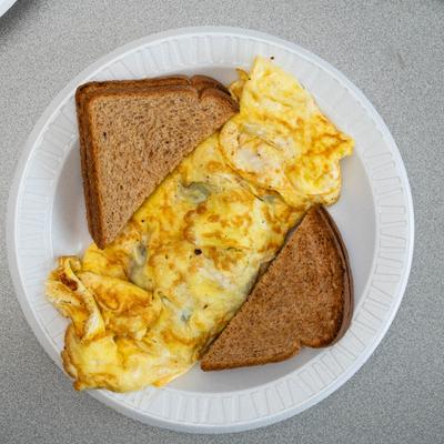 Omelette served with toasted bread, overhead view.
