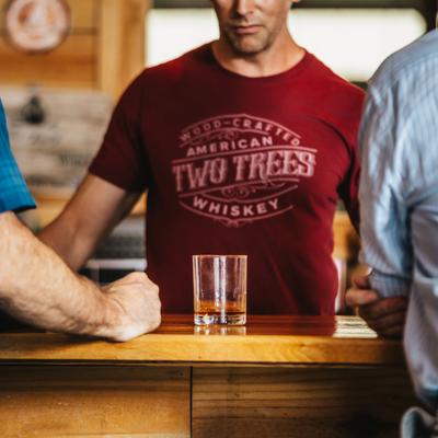 People standing at the bar.