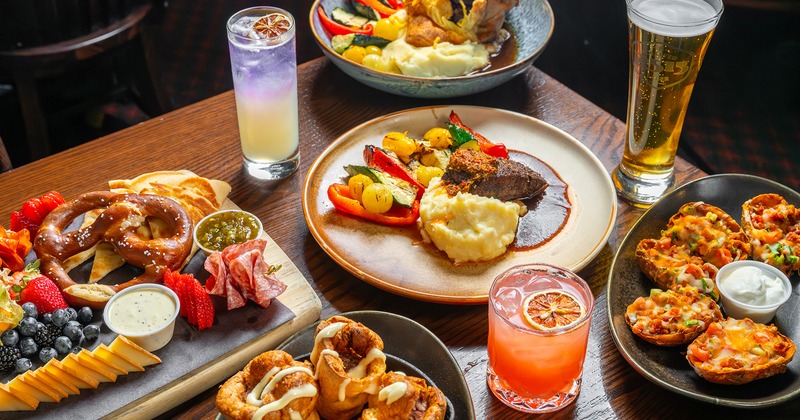 A table with diverse dishes and drinks