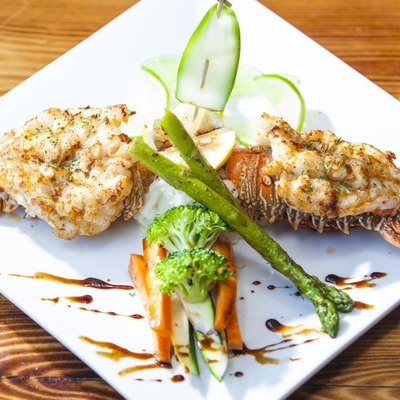Lobster tail with vegetables.