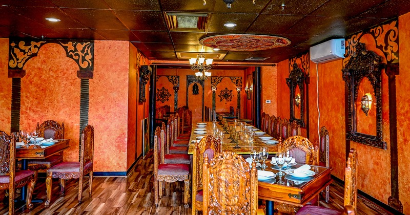 Dining area in Indian-style design with set dining tables