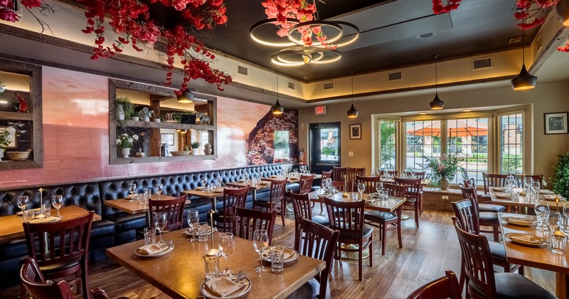 Elegant dining room with floral ceiling decor and scenic mural