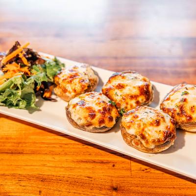 Crab stuffed mushrooms, served, front view.