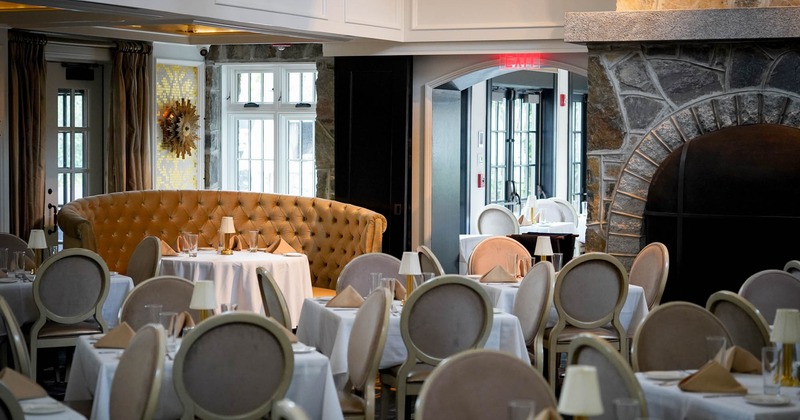 Interior, dining area, tables for four, large ''U'' shaped seating booths with table in the back