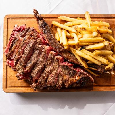 Tomahawk steak, with fries.