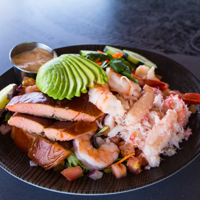 Fish, shrimp, avocado and vegetables dish