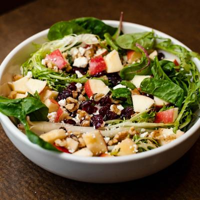 Apple cranberry feta salad in a bowl.