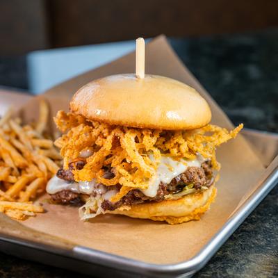 Cheeseburger with crispy onion strings.