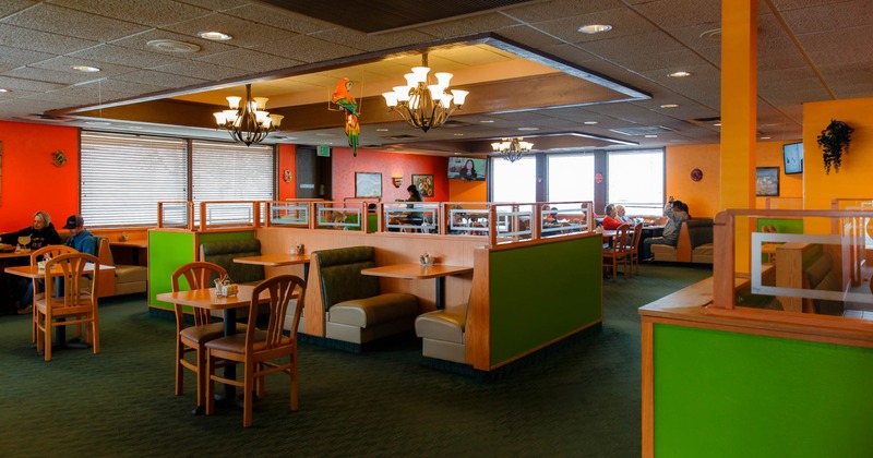 A seating area with four booths in the middle