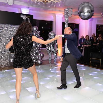 A couple dancing on the dance floor.