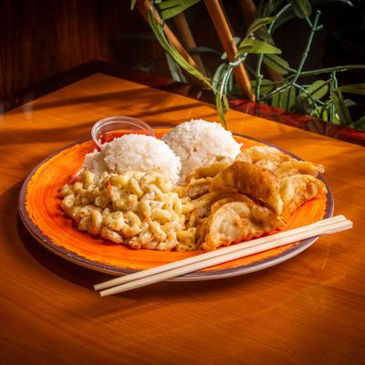 Fried dumplings served with rice and macaroni salad.