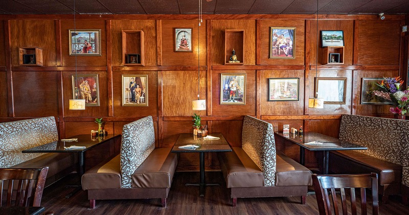 Interior, dining booths by a wooden wall